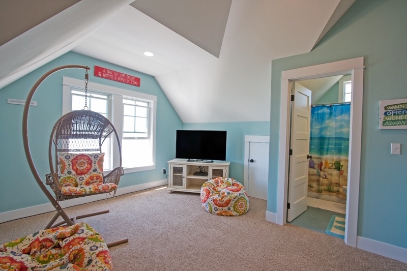 Third floor with flat screen TV and view of the ocean