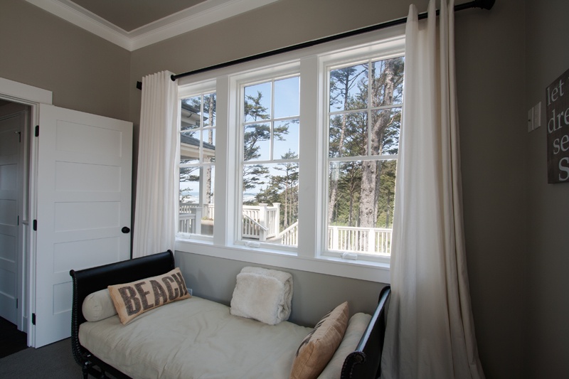 Main floor queen bedroom with ocean view