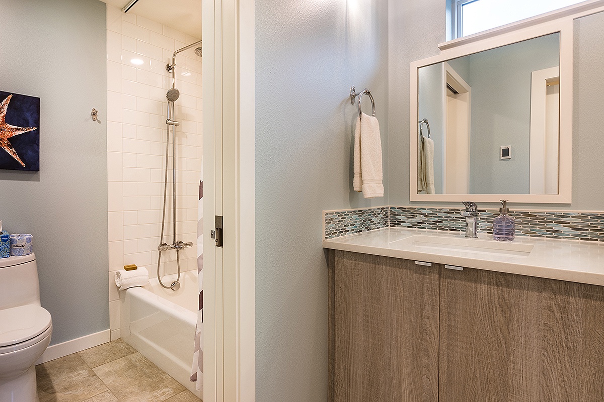 2nd floor hallway bathroom with rain shower, bathtub, and heated floors