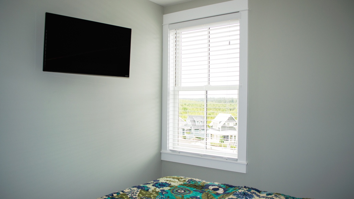 Upper Level - Guest bedroom with flat screen TV