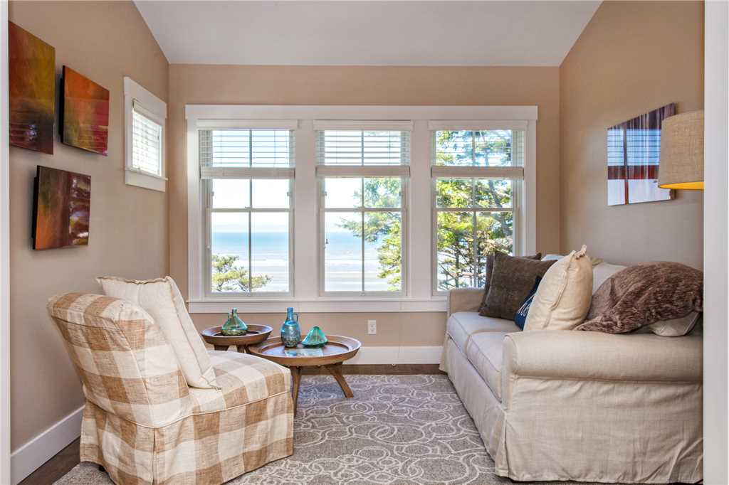 Sitting room and view of ocean, upstairs primary left king bedroom