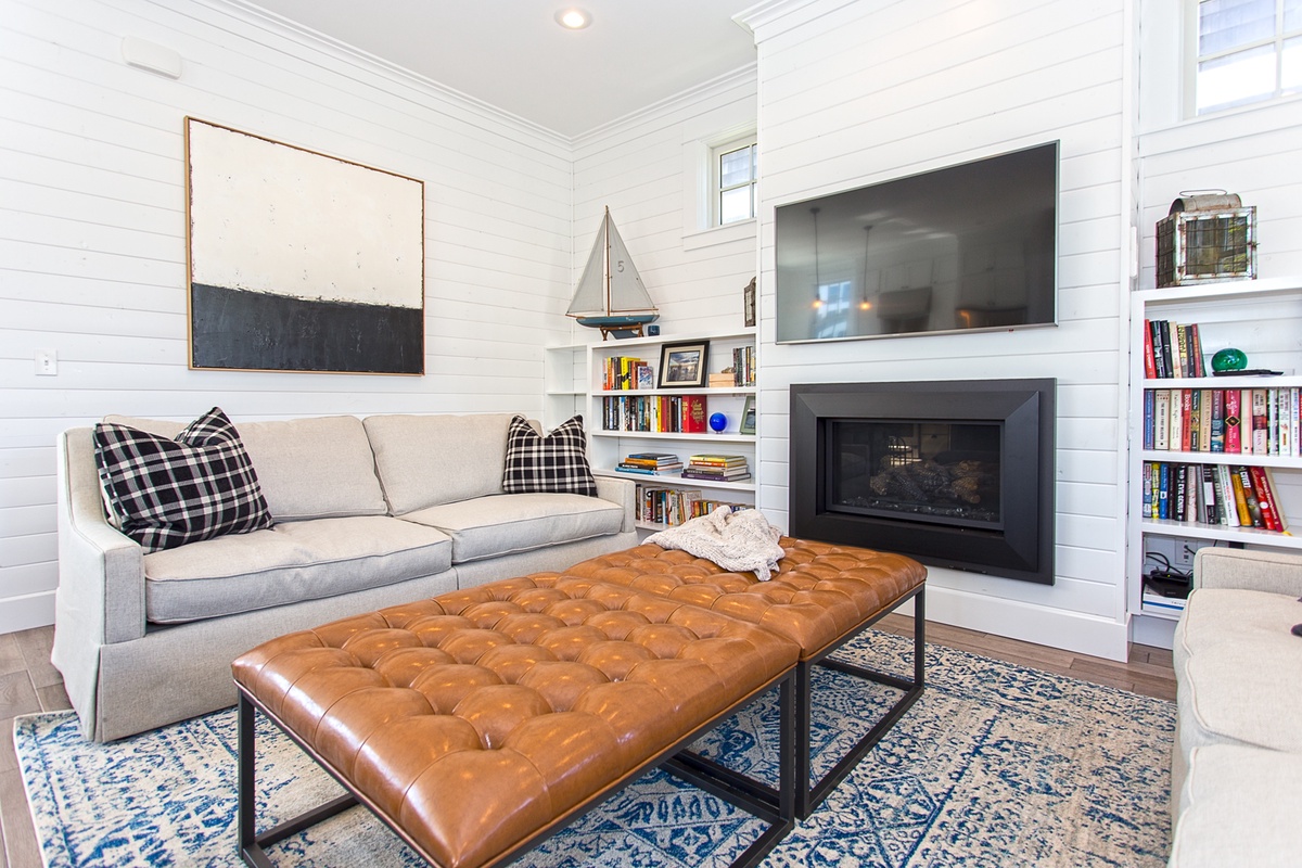 Living room with gas fireplace and TV
