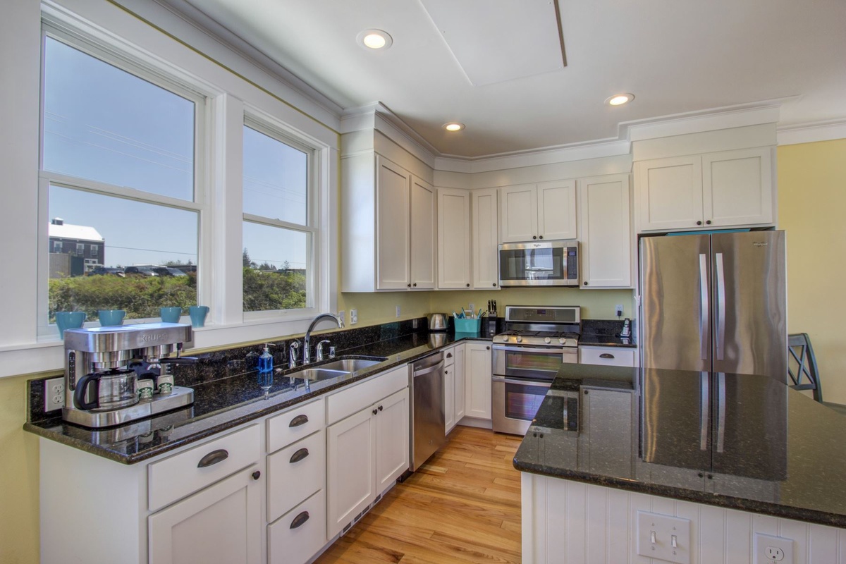 Kitchen is equipped with  granite countertops and stainless steel appliances