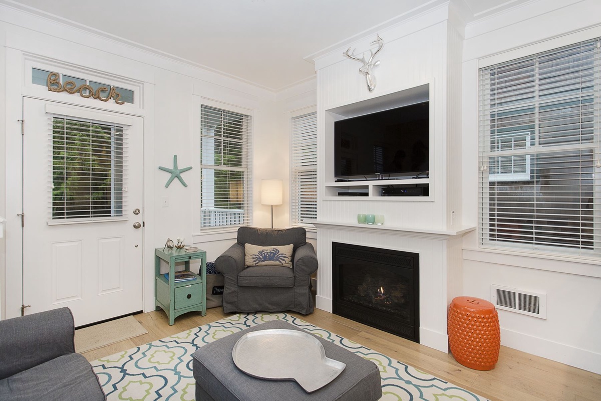 Living room with gas fireplace and flat screen TV