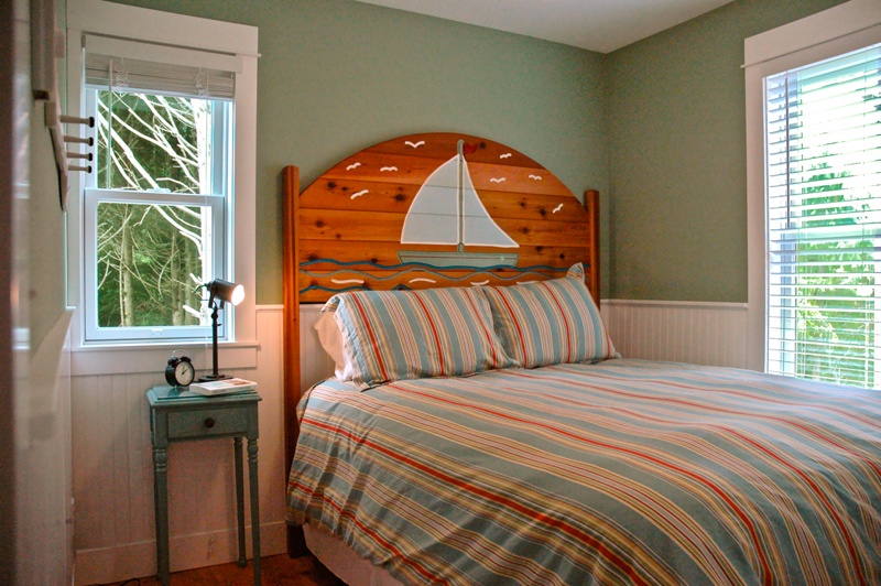 Main floor queen bedroom is designed with relaxation in mind
