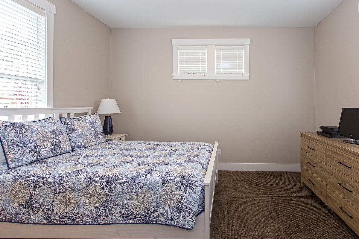 Main floor Queen Primary Bedroom with five piece primary bath