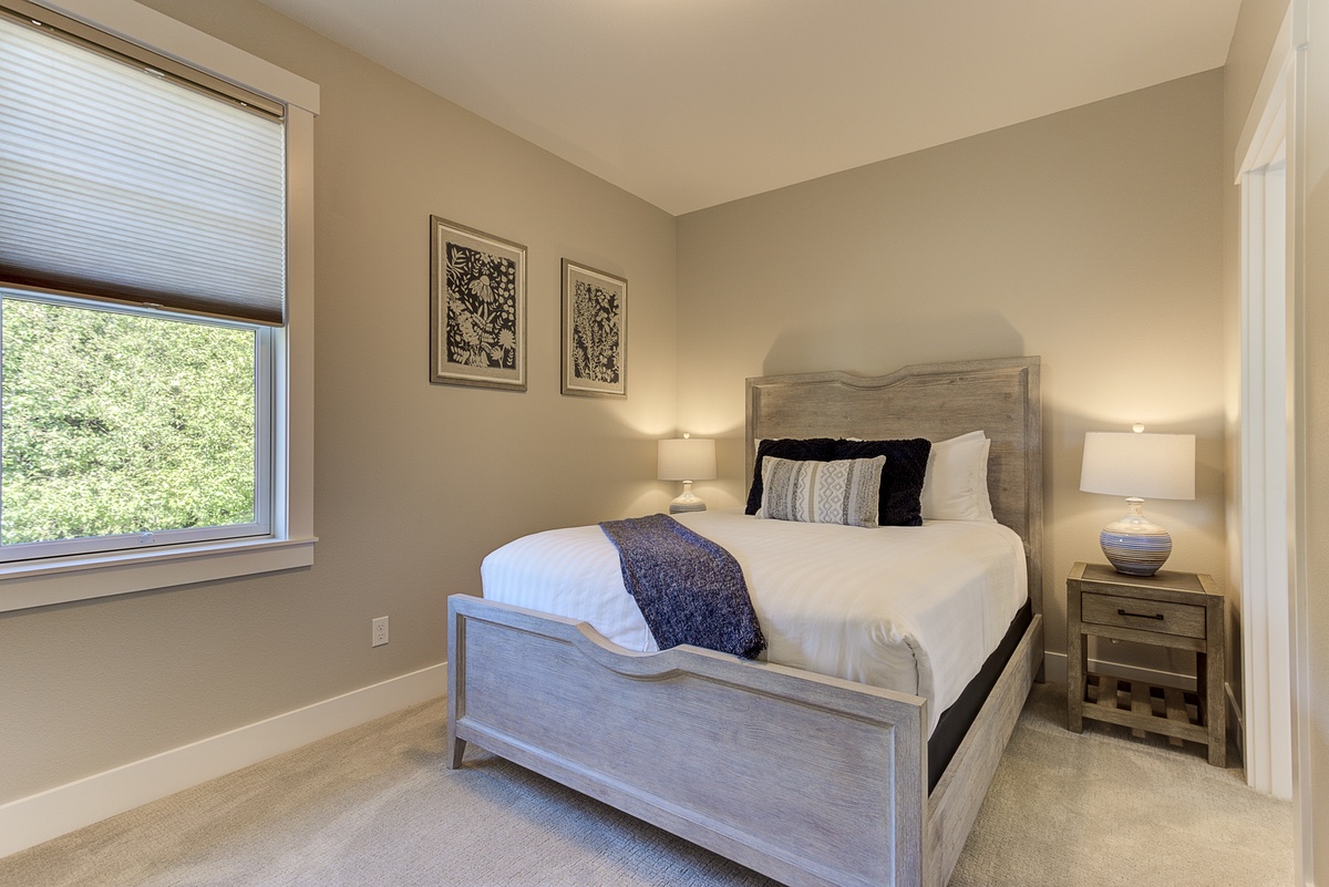 The guest bedroom offers comfort for a restful stay