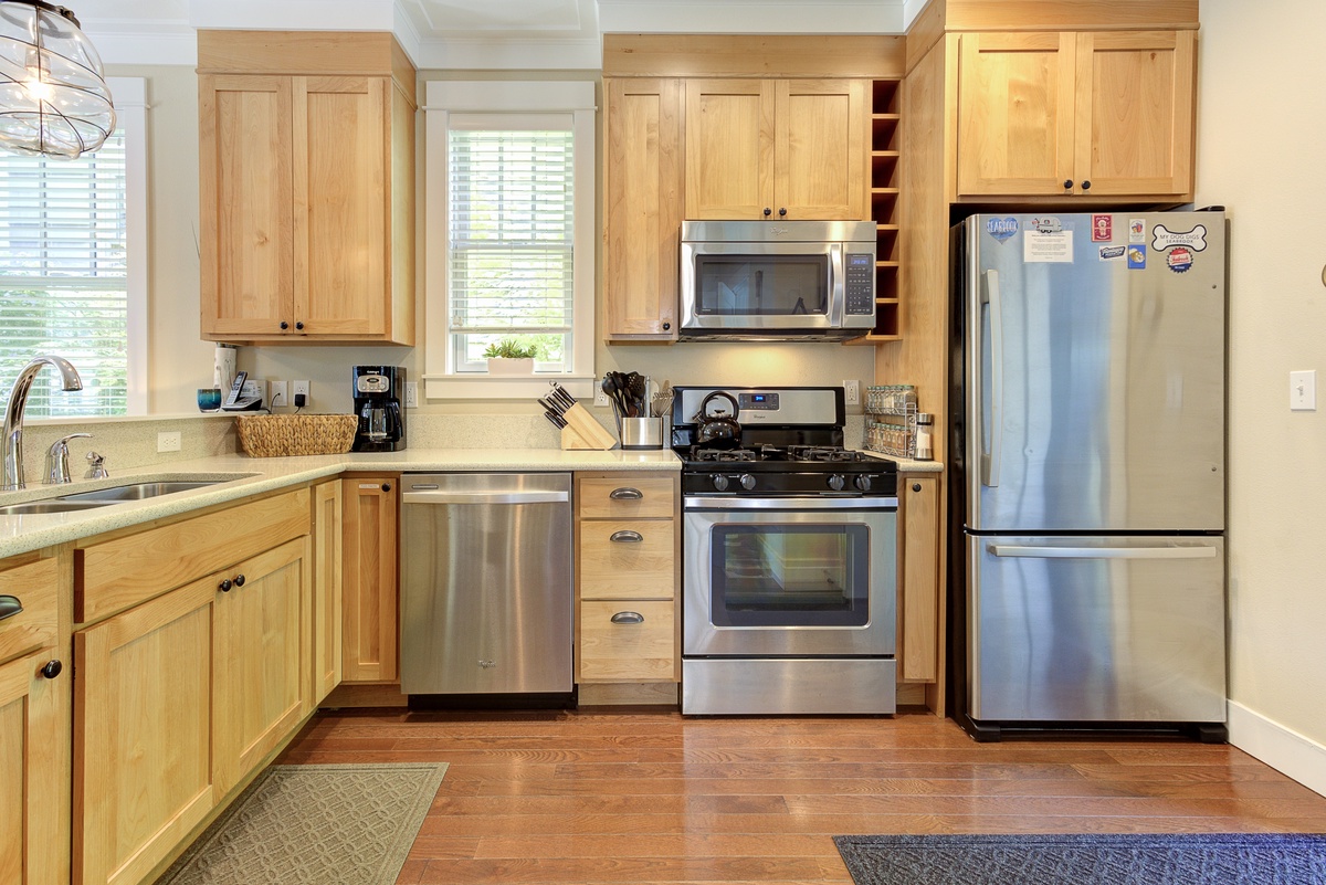 The kitchen is well-equipped with a gas range