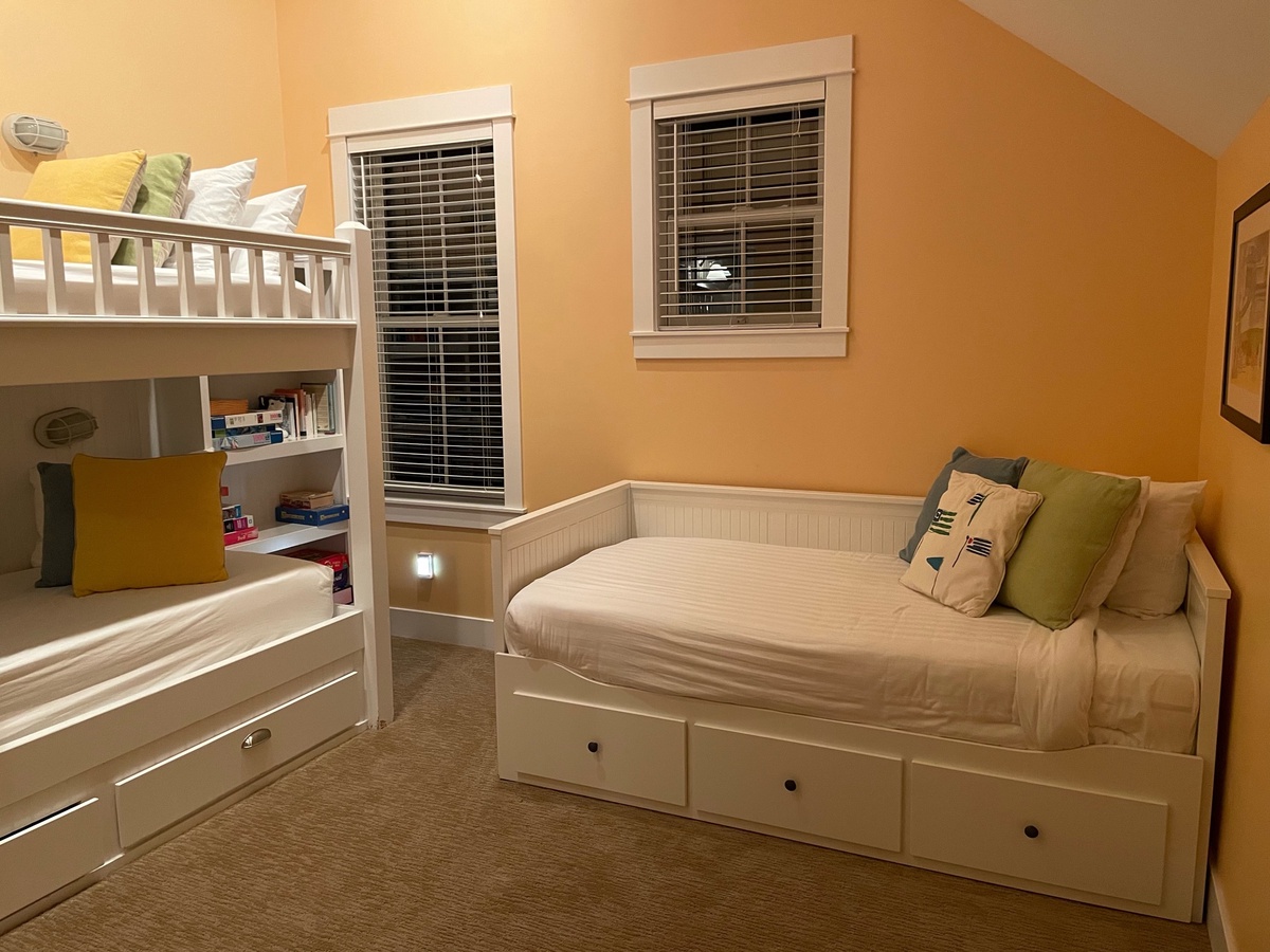 Bunk bedroom with extra-long twins and daybed pulls out to a king bed