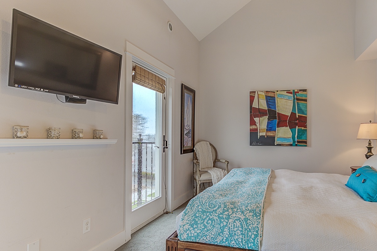Primary king suite, with flat screen TV has two private doors opening to a nice ocean breeze and a view above Front Street