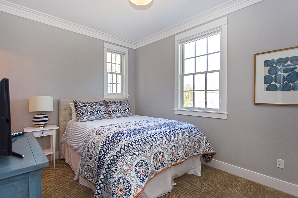 The second floor queen bedroom offers comfort, style and relaxation