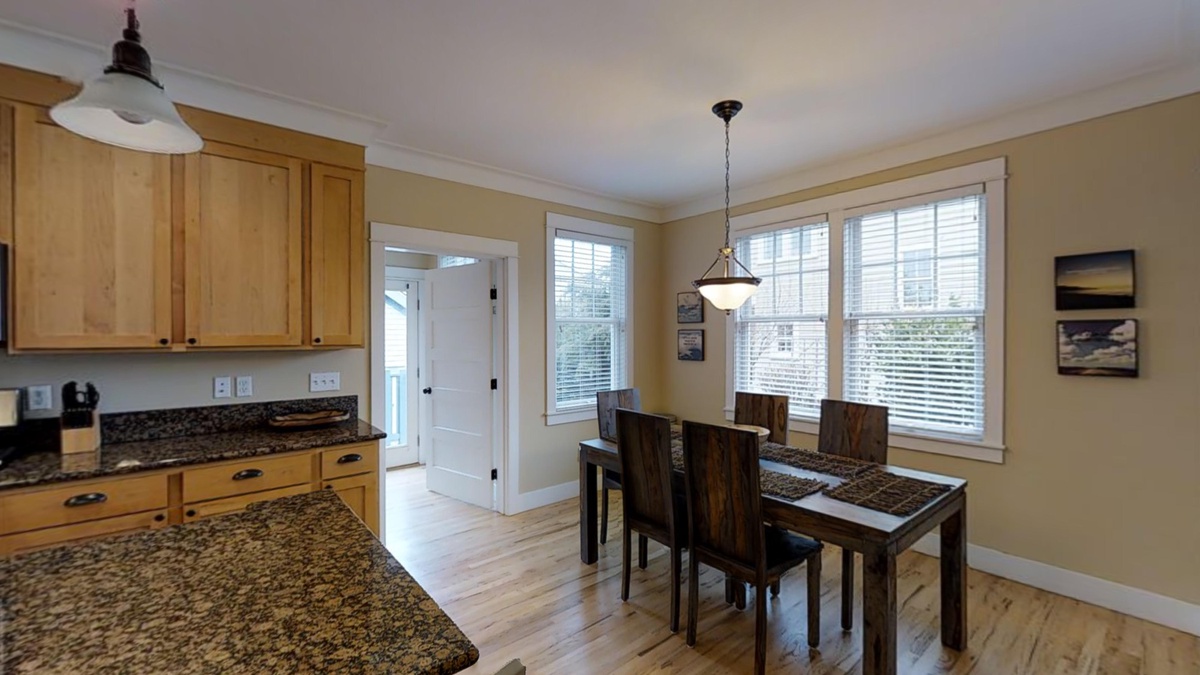 The dining table is conveniently located directly off the kitchen for maximum togetherness