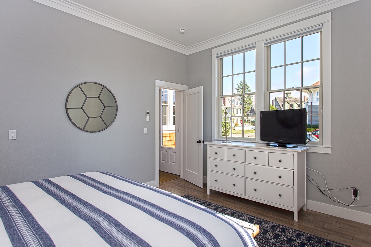 Spacious main floor California king bedroom is designed for restful nights and peaceful mornings