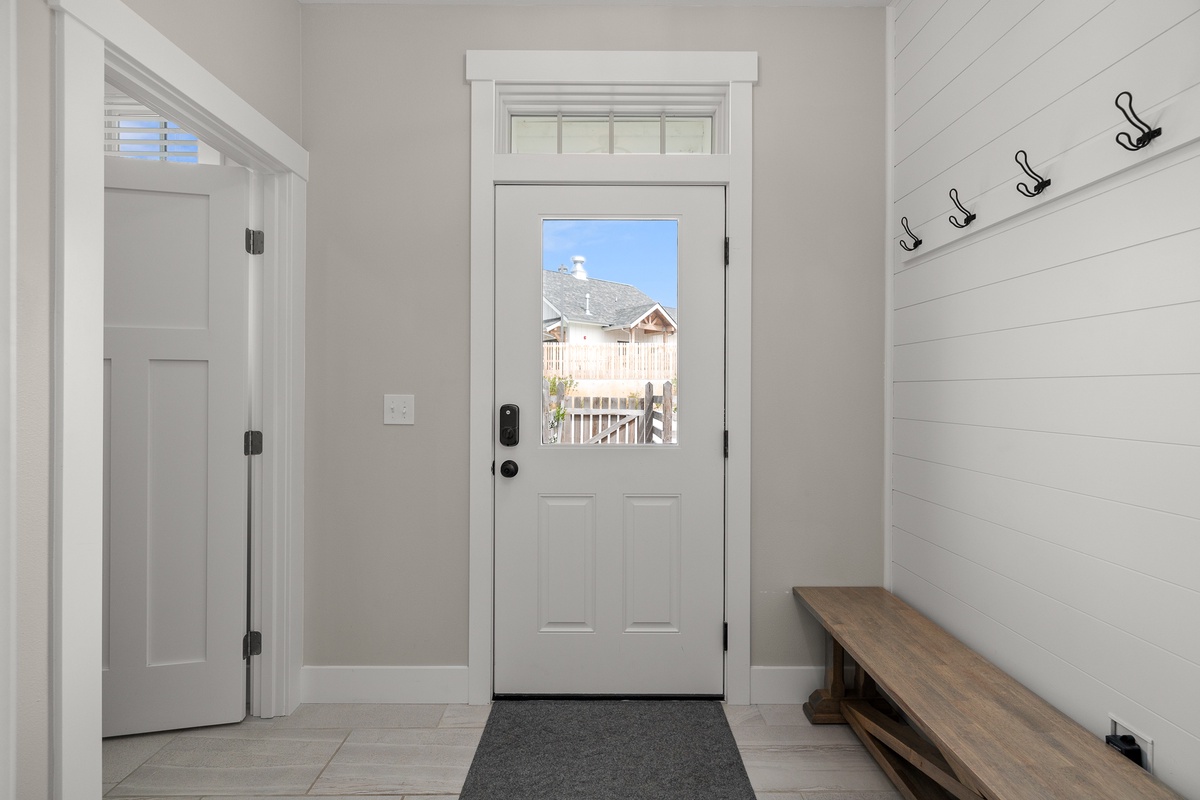 Mudroom leads to the backyard