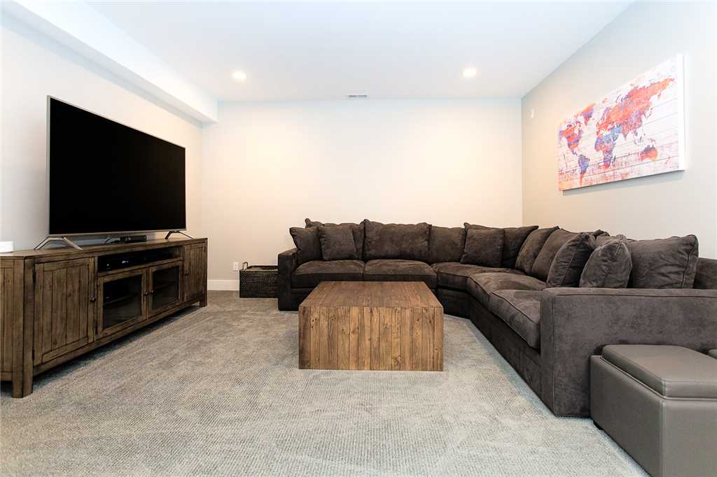 Lower floor living room with 75-inch smart TV