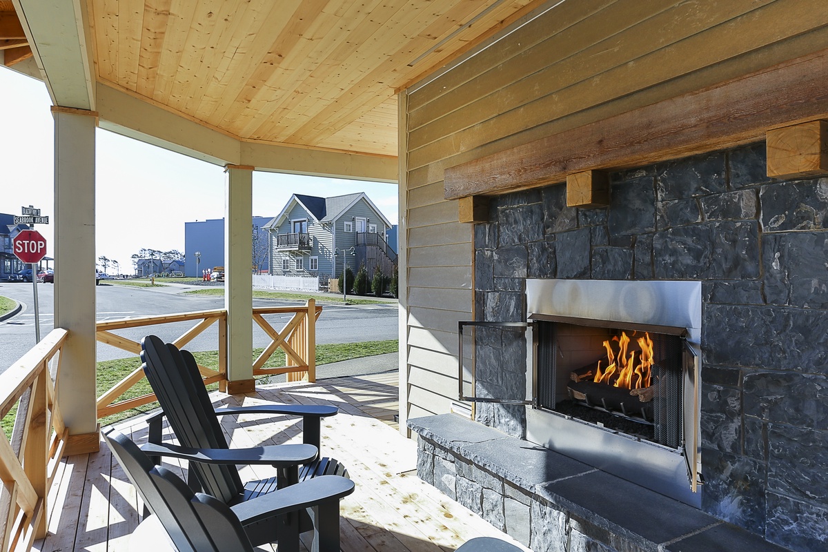 Our covered deck with a fireplace offers the perfect spot to relax in any season