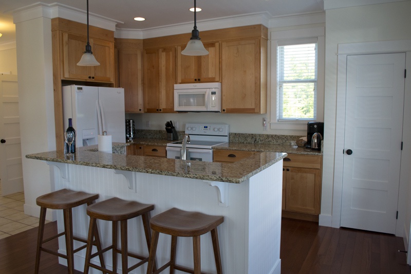 Kichen with granite countertops and breakfast bar