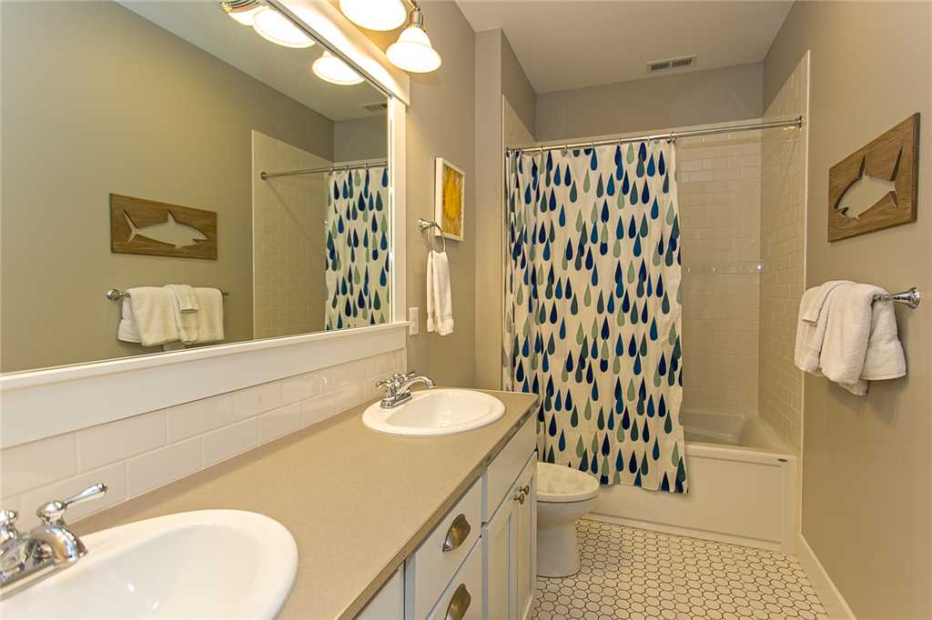 Additional full bathroom with double sinks on lower floor