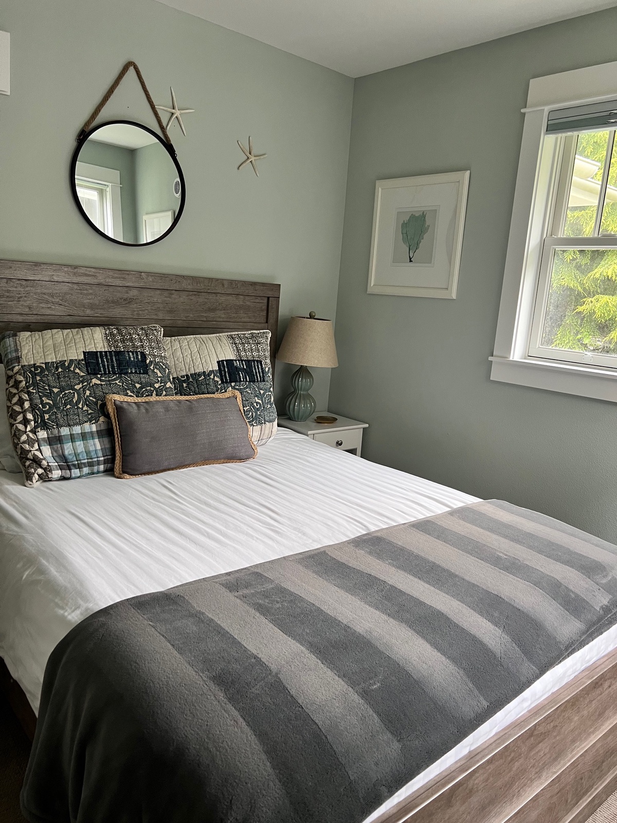 Main floor bedroom offers a plush queen bed for the perfect nights sleep