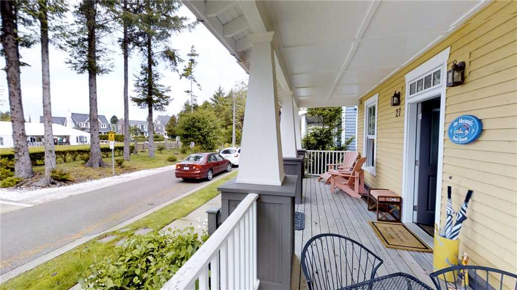 Covered front porch with view of Crescent Park