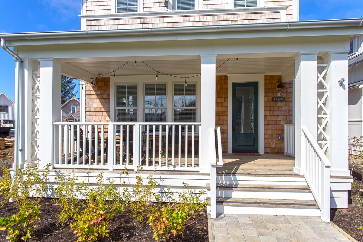 Covered front porch overlooking park