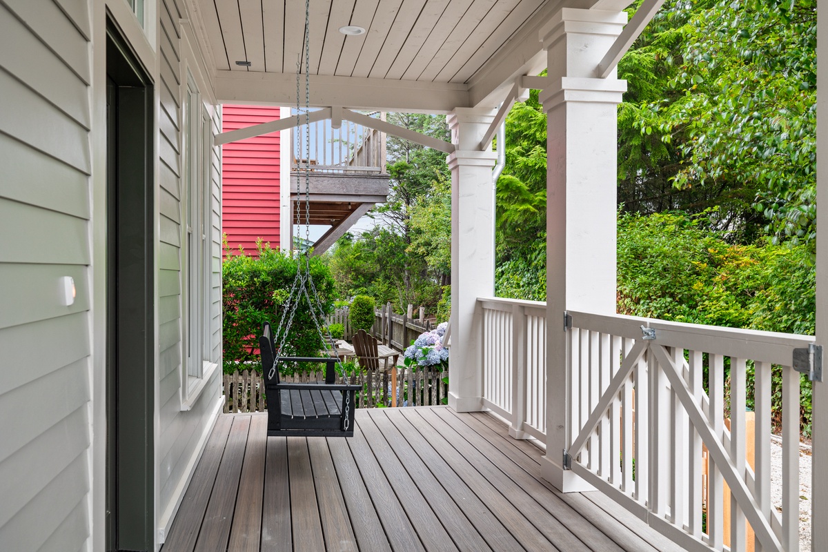 Porch swing facing Woodland Promenade