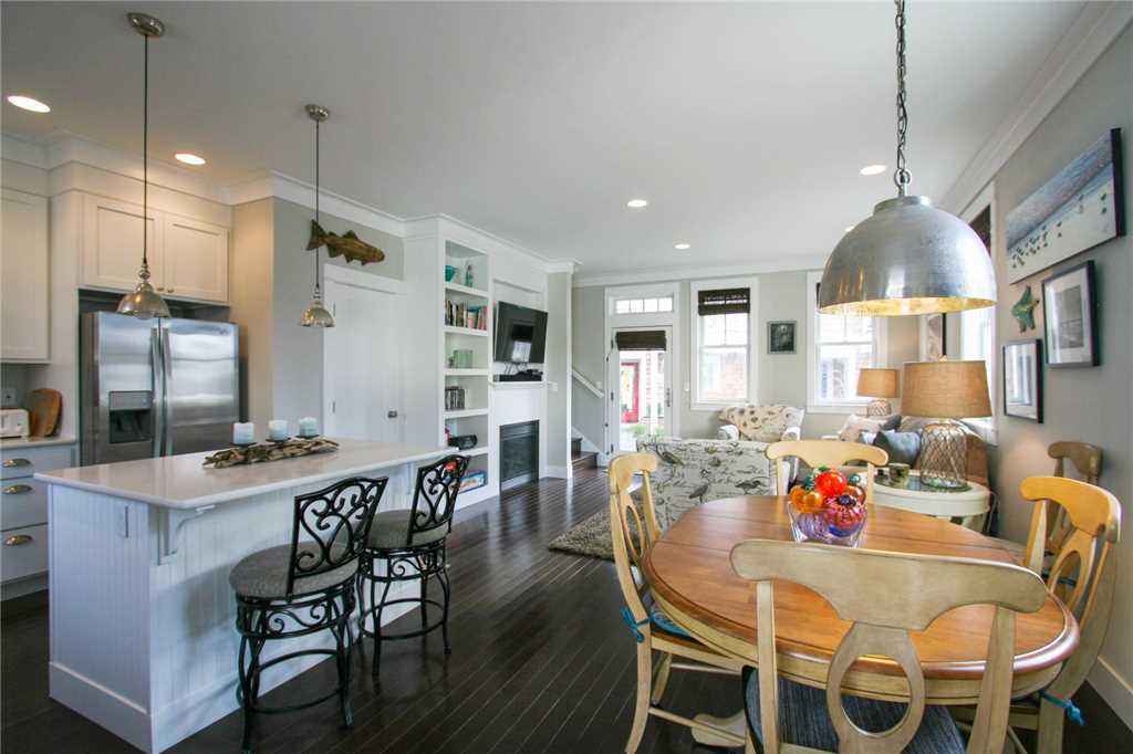 Plenty of seating at the dining room table and the kitchen island