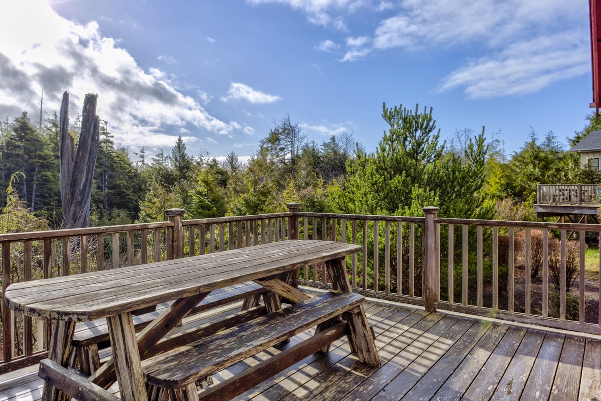 Back deck off the kitchen with outdoor seating