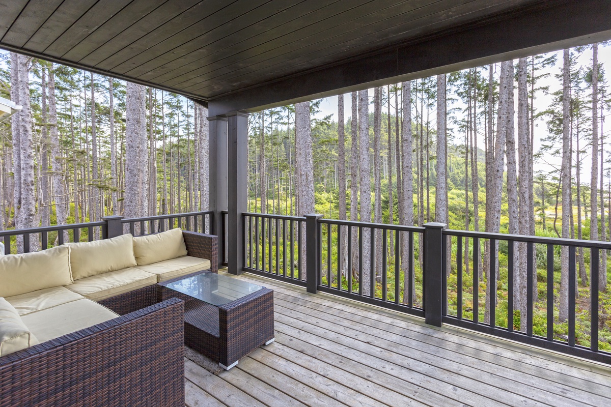 Covered deck with ocean views and outdoor seating	