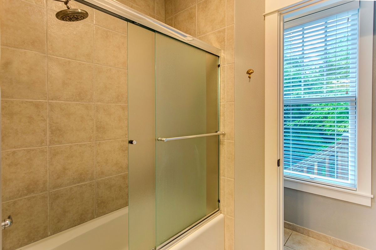 Main floor shared bathroom is designed for comfort and ease during your stay