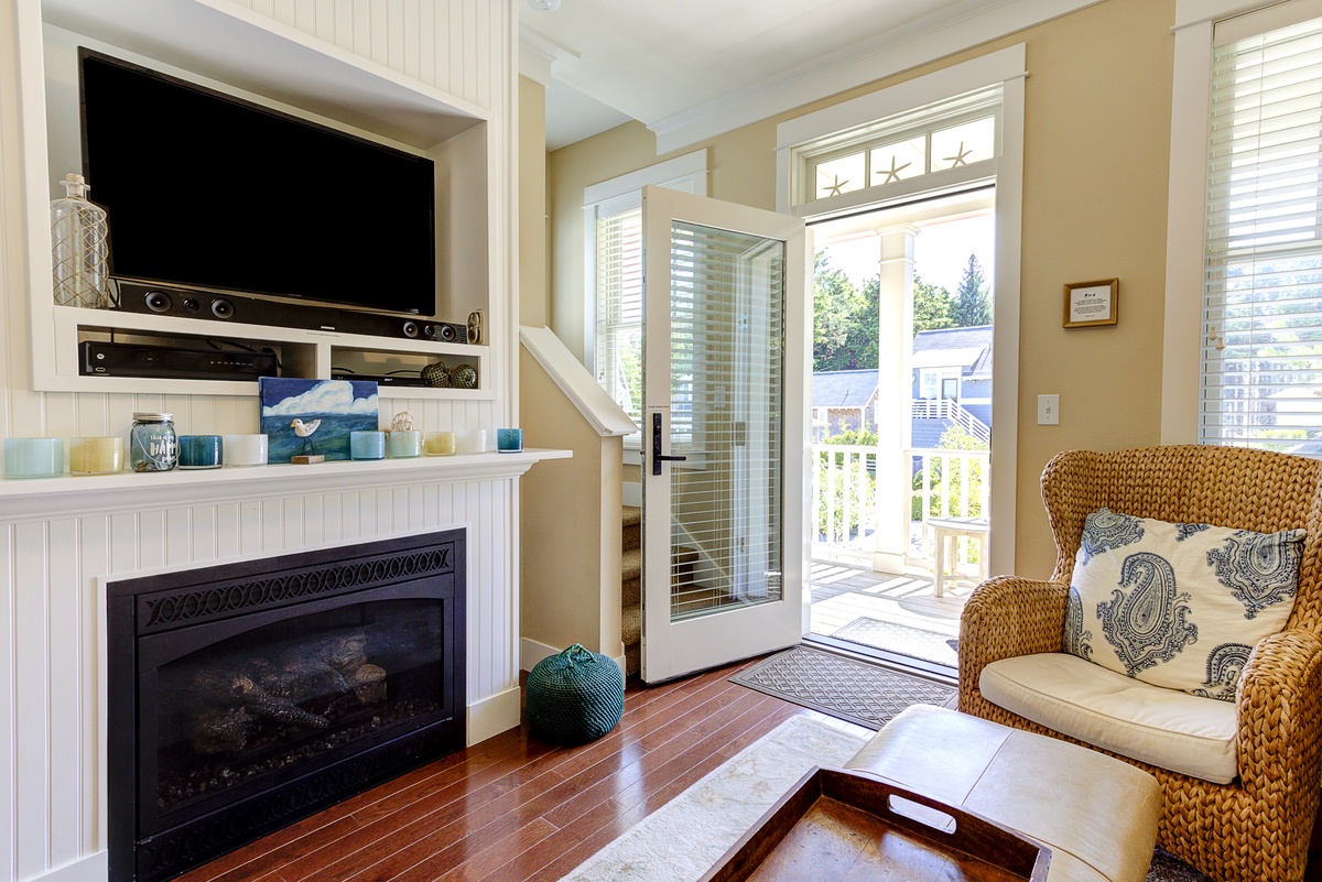 The covered porch leads into the living room