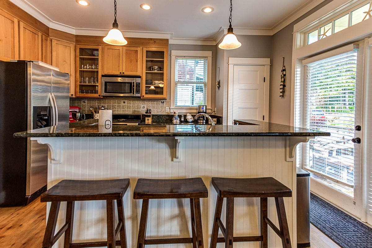 Kitchen with bar seating for three