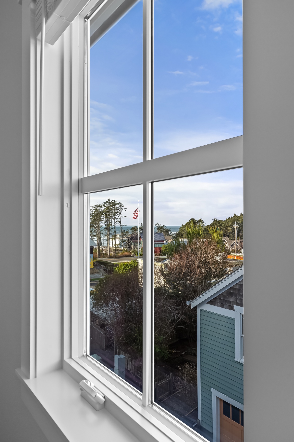 Wake up to an ocean view from the primary bedroom window
