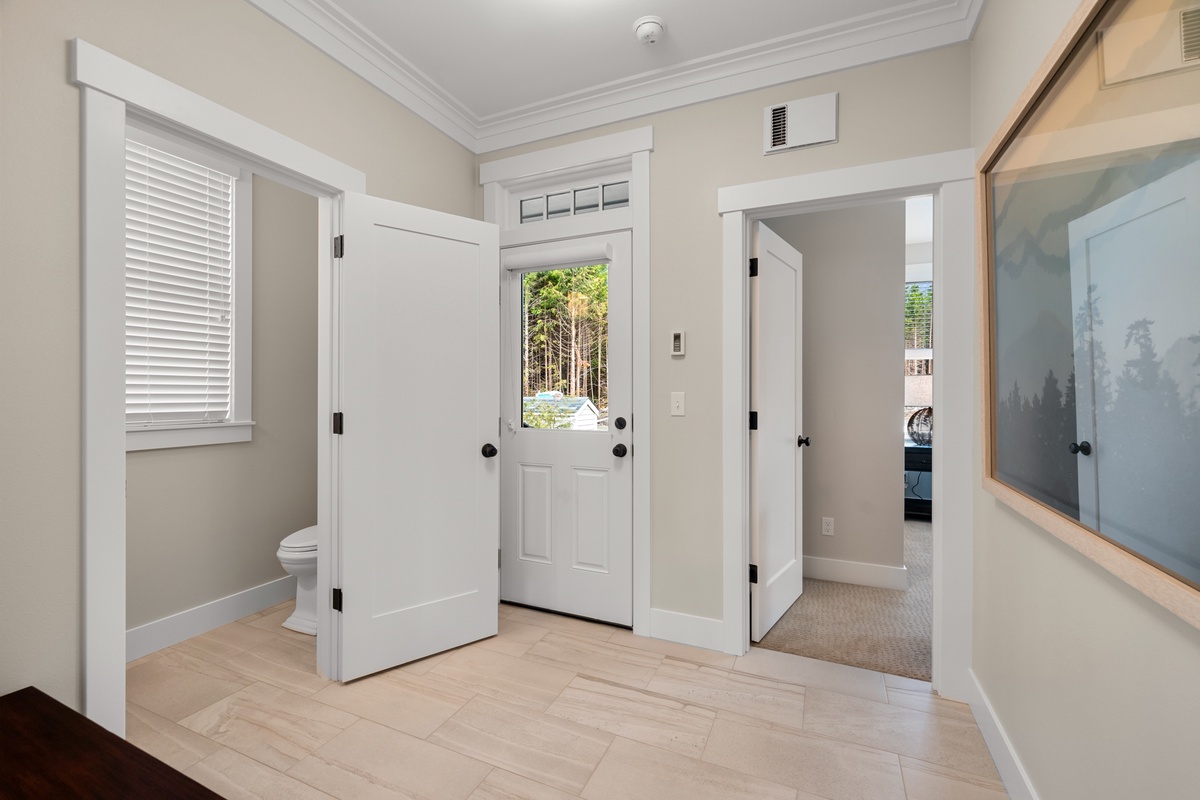 Mudroom leads to the backyard