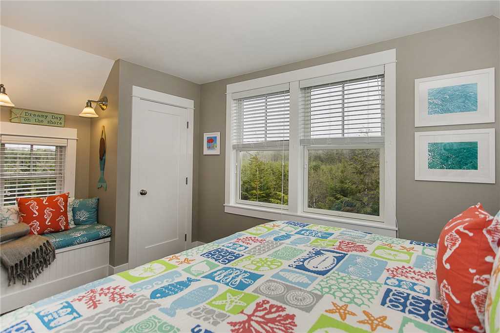 Primary king bedroom with forest views