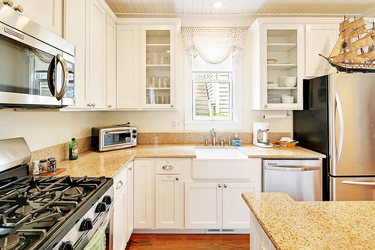 The kitchen is equipped with granite countertops and stainless steel appliances