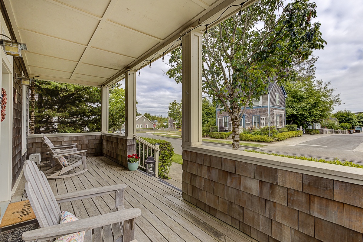 Relax and enjoy the specious front porch with Adirondack rockers