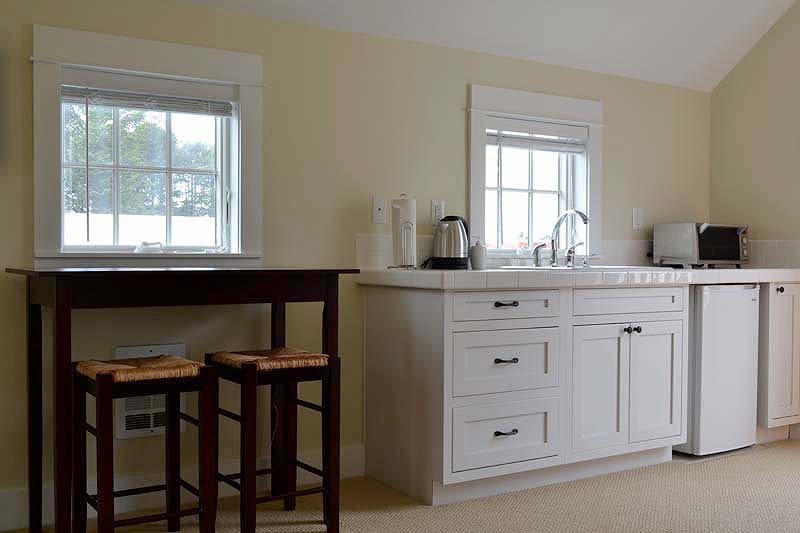 The carriage house kitchenette is perfect for quick meals and cozy mornings