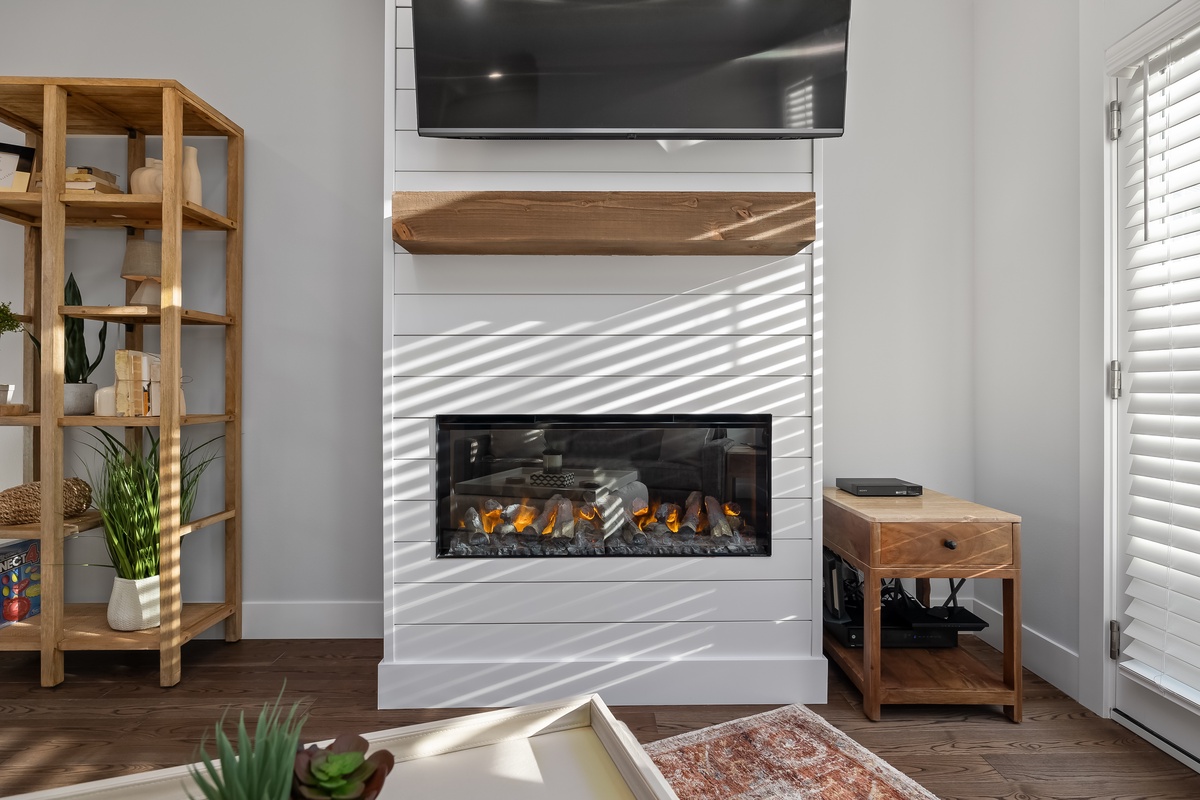 Warm up by the fireplace while watching your favorite TV shows