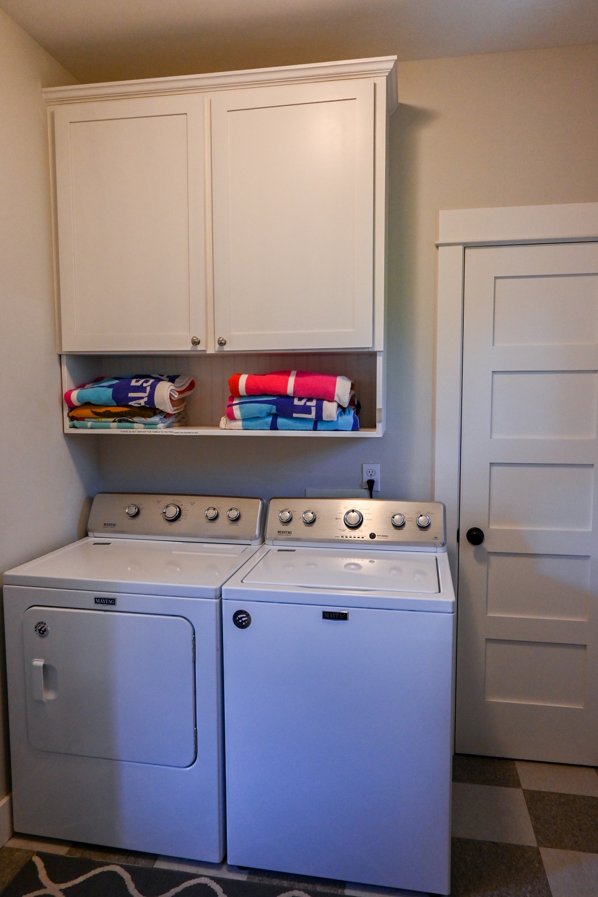 First floor laundry room and mudroom offers convenience during your stay