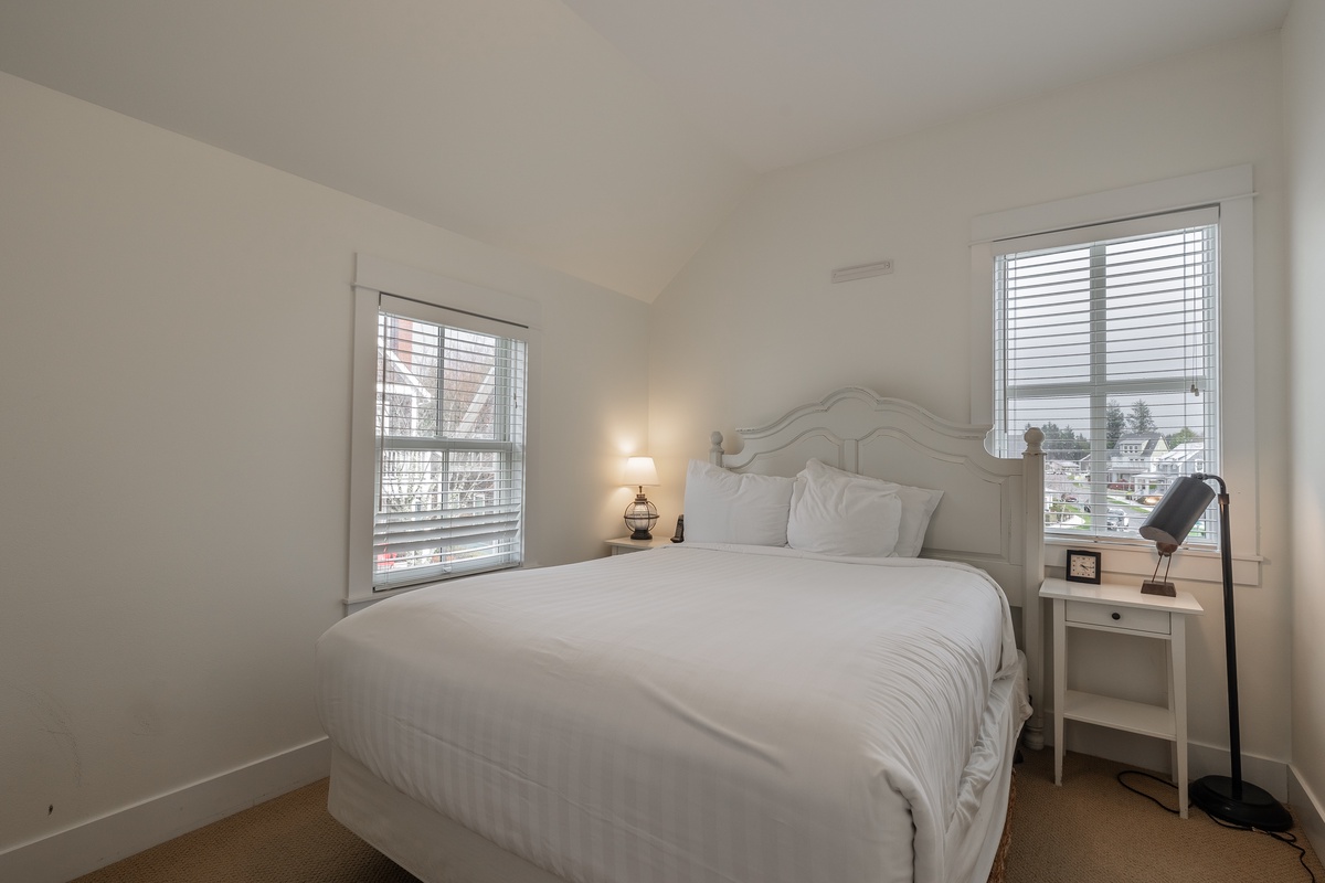 The spacious primary bedroom offers comfort, style and relaxation