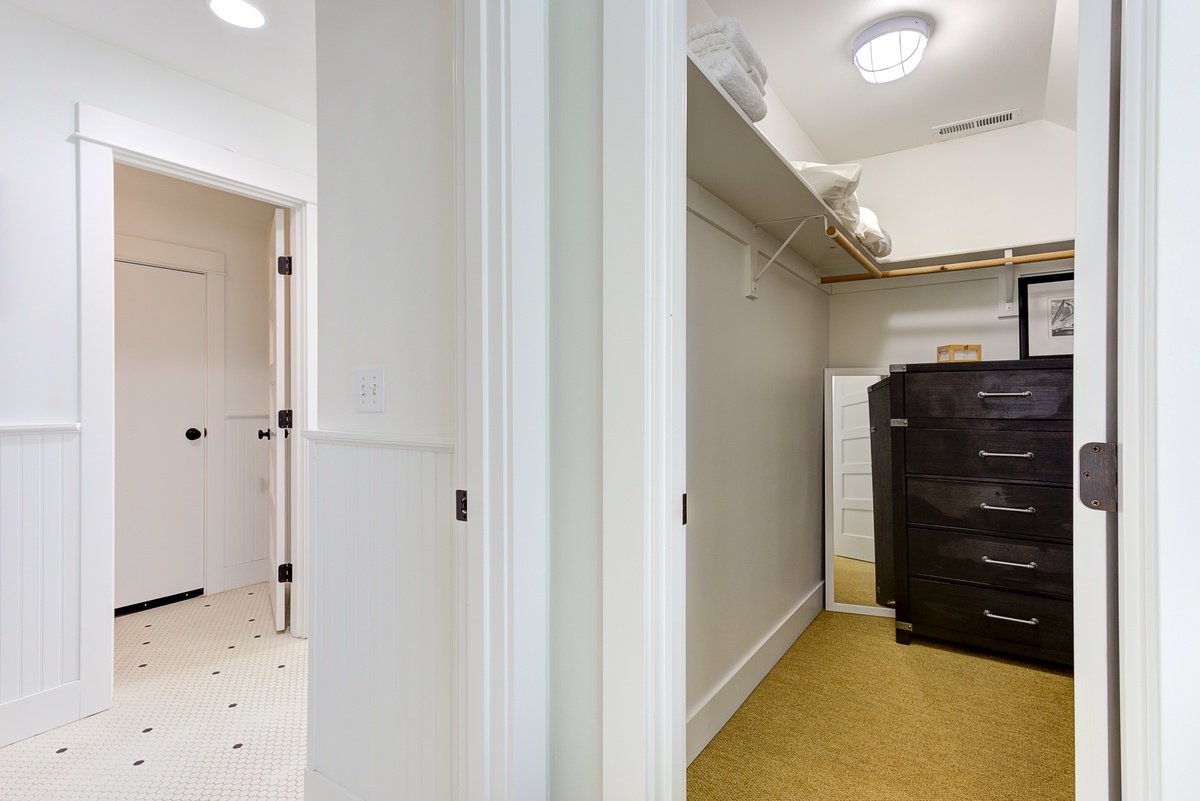 walk in closet and primary bathroom