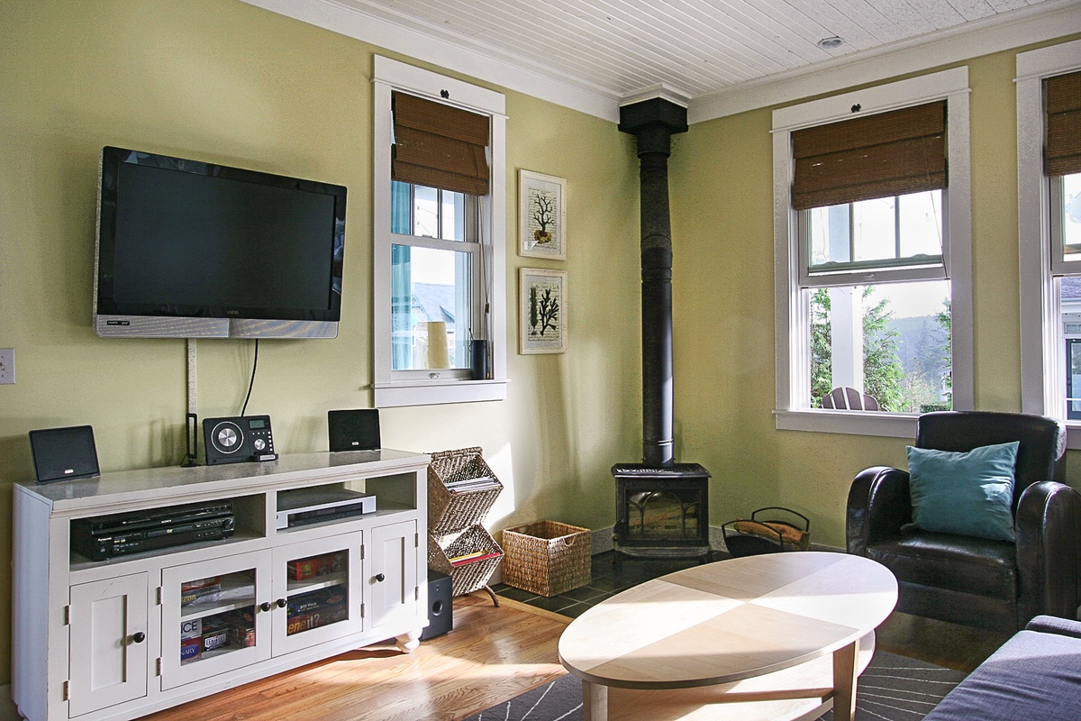 Living room has a wood burning fireplace