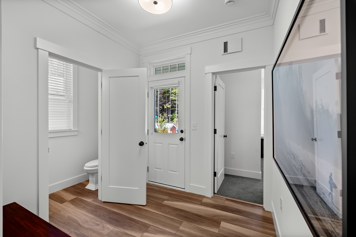 Mudroom leads to the backyard