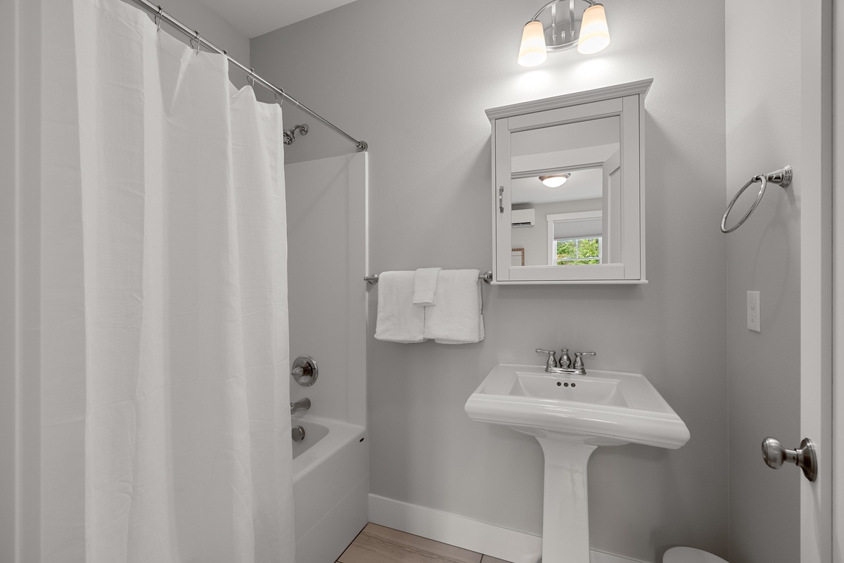 Primary ensuite bath located downstairs
