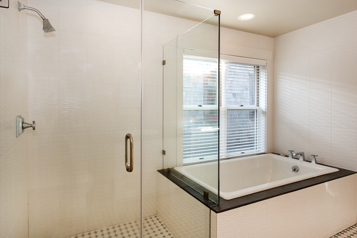 Second Floor - Primary King Suite bathroom with large soaking tub and shower