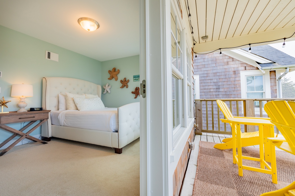 Bedroom and deck offer ocean views