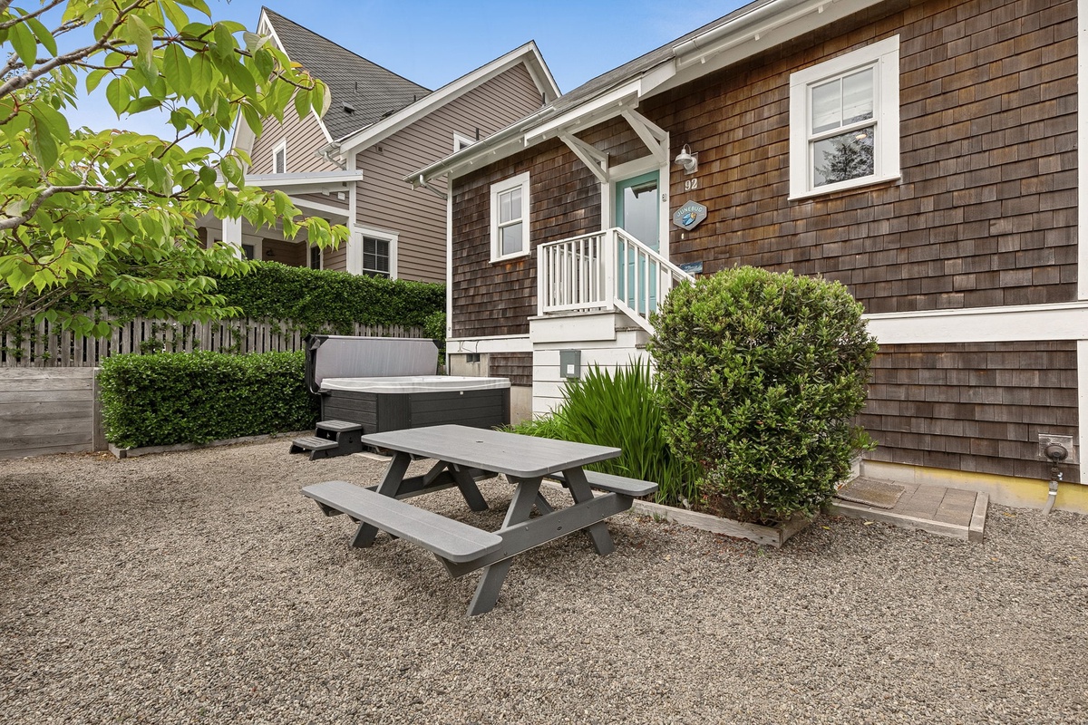 Fully fenced back yard with picnic table