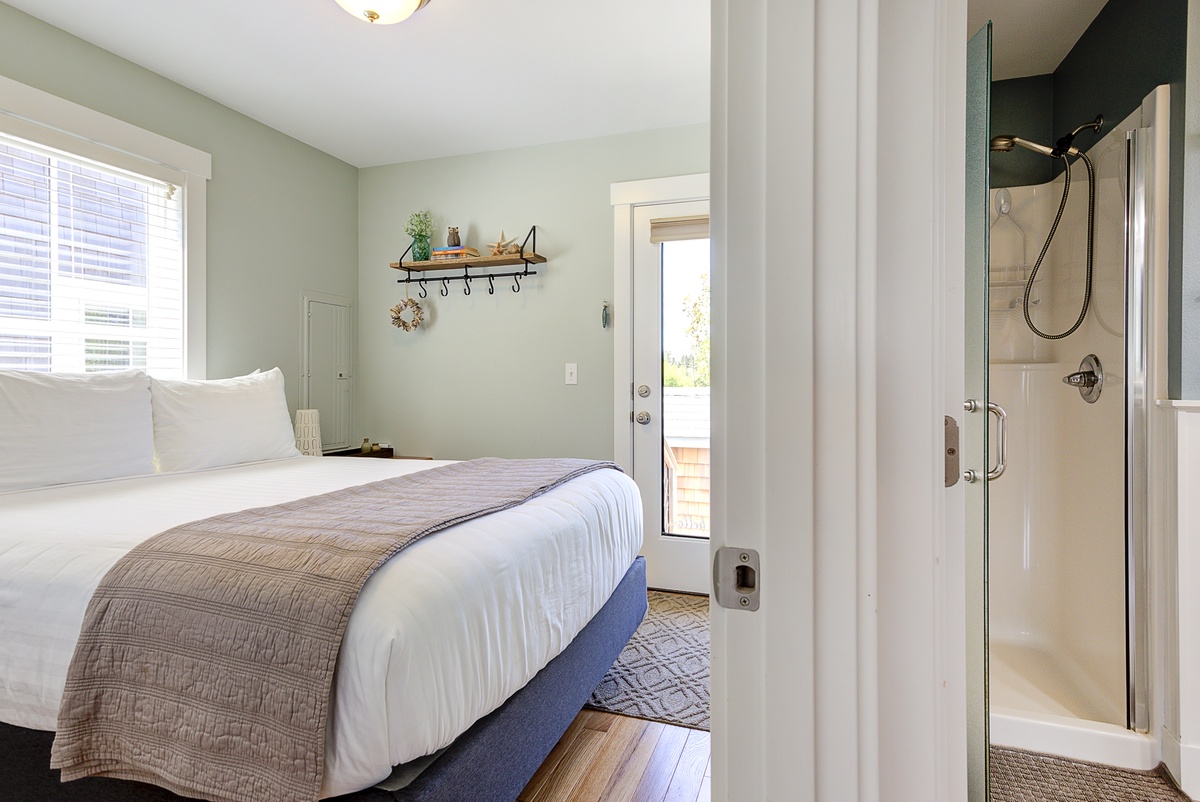 Main floor bedroom with door out to hot tub