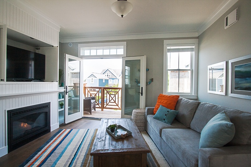 Second floor living room with gas fireplace and flat screen tv